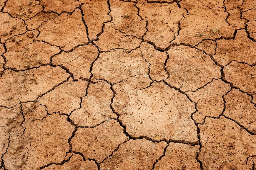 Close-up of cracked dry earth texture background