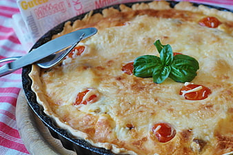 Fresh Quiche with Basil Garnish in Cast Iron Pan