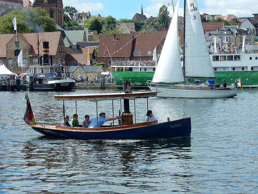 Vintage steamboat Heihoo sailing in Flensburg harbor festival