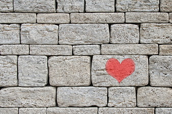 Red Heart Painted on Gray Stone Wall Texture