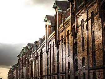 Low-angle view of historic brick warehouse buildings
