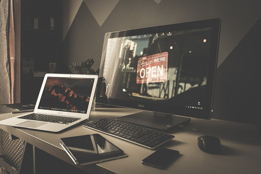 Modern Workspace with Laptop, Monitor, and Tablet