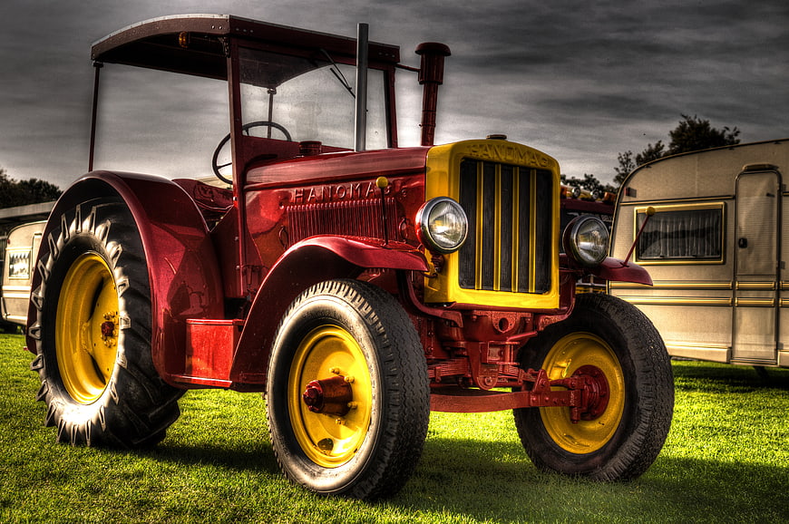 Vintage Red Farmall Tractor on Green Grass