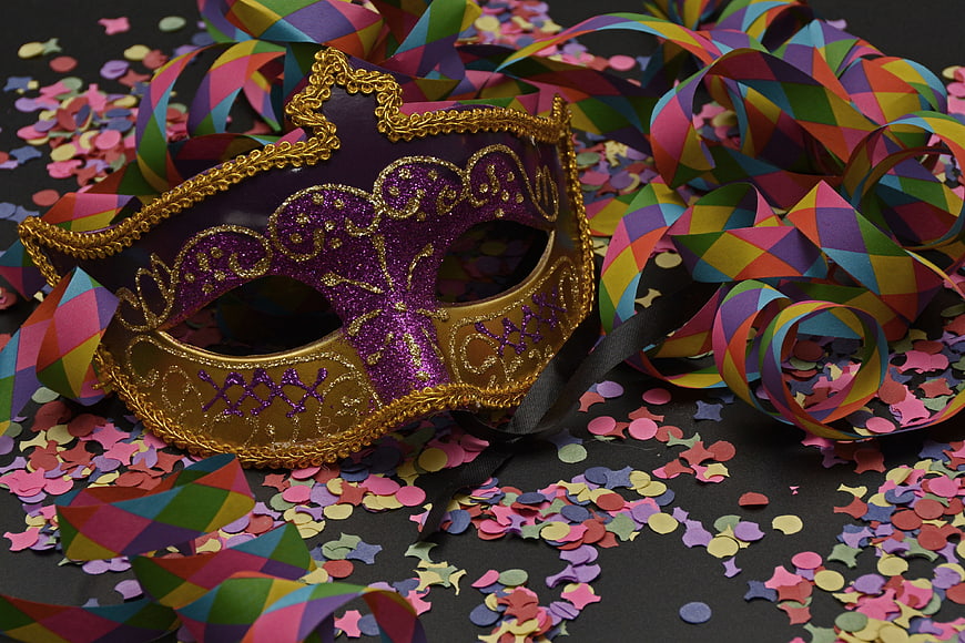 Purple and Gold Venetian Masquerade Mask with Colorful Confetti and Streamers