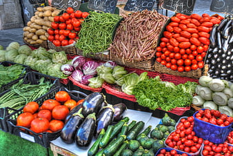 Colorful Fresh Vegetables Displayed In Baskets At Outdoor Market
