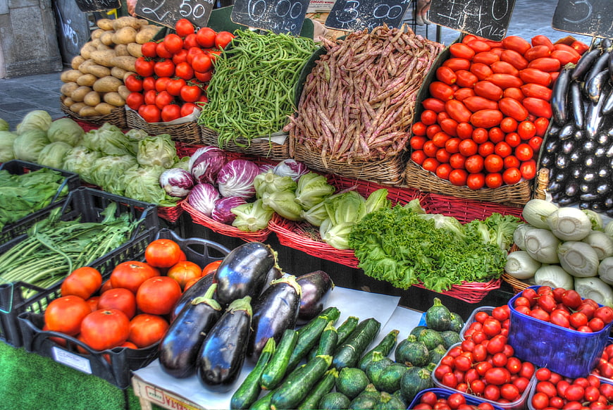 Colorful Fresh Vegetables Displayed In Baskets At Outdoor Market