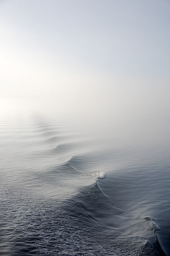 Minimalist Ocean Waves in Misty Fog