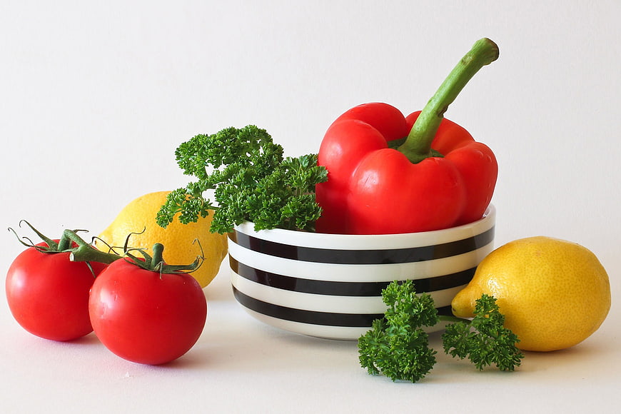 Fresh Vegetables and Lemons in Striped Bowl