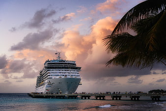 Cruise Ship Docked at Tropical Pier at Sunset