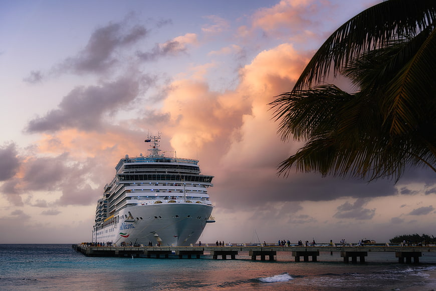 Cruise Ship Docked at Tropical Pier at Sunset