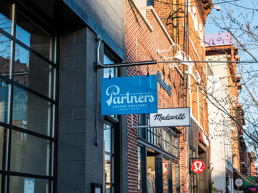 Brooklyn storefronts with Partners Coffee and Madewell signs