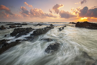 Long Exposure Sunset Over Rocky Ocean Coastline