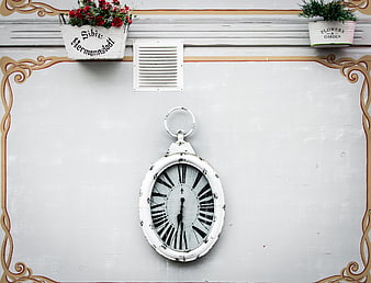 Vintage White Clock on Wall with Flower Pots