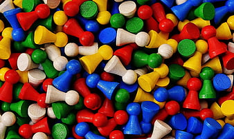 Colorful Wooden Game Pieces Scattered in a Pile