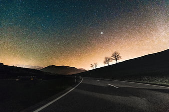 Milky Way Night Sky Over Mountain Road With Silhouetted Trees