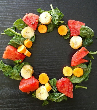 Healthy Fruit and Vegetable Wreath on Dark Wooden Surface