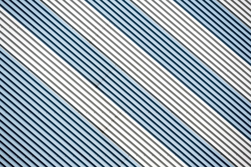 Abstract diagonal blue and white architectural lines pattern