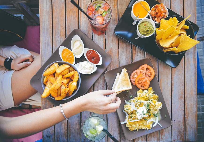 Overhead View of Casual Dining with Fries, Eggs, and Nachos
