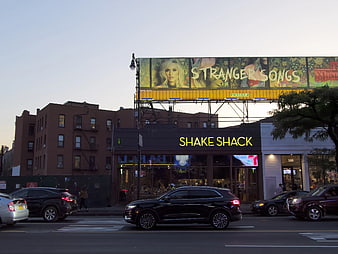 Shake Shack Restaurant with Billboard in Brooklyn at Sunset