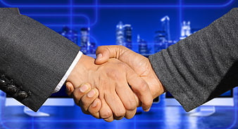 Business Handshake Against Blue Digital City Skyline Background