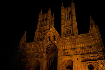 Gothic Cathedral Illuminated at Night with Golden Lighting