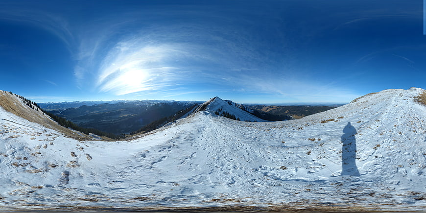 360-degree panoramic view of snowy mountain ridge in winter