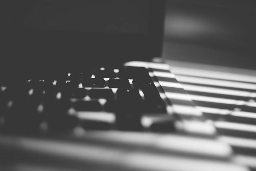 Black and White MacBook Keyboard with Striped Shadows