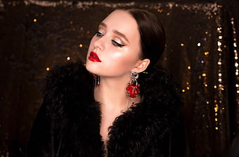 Elegant Woman Portrait Wearing Black Fur Coat and Red Earrings
