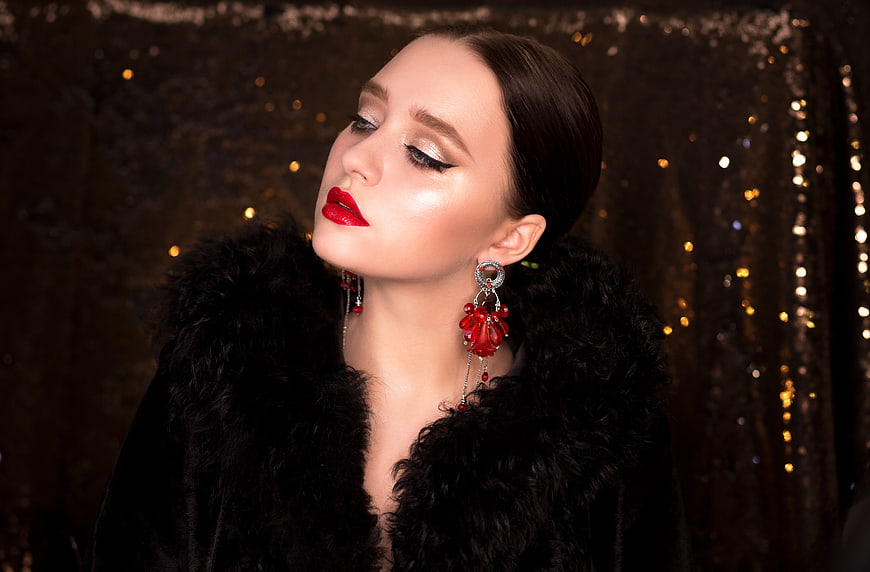 Elegant Woman Portrait Wearing Black Fur Coat and Red Earrings