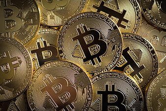 Close-up of shiny gold Bitcoin cryptocurrency coins