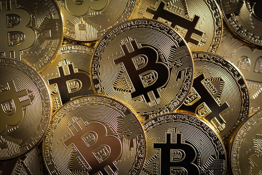 Close-up of shiny gold Bitcoin cryptocurrency coins