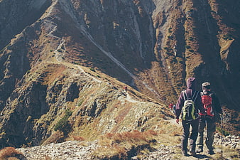 Hikers on Mountain Trail with Scenic Valley View