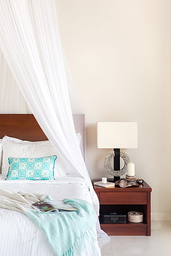 Cozy Bedroom Interior With White Canopy Bed And Wooden Nightstand