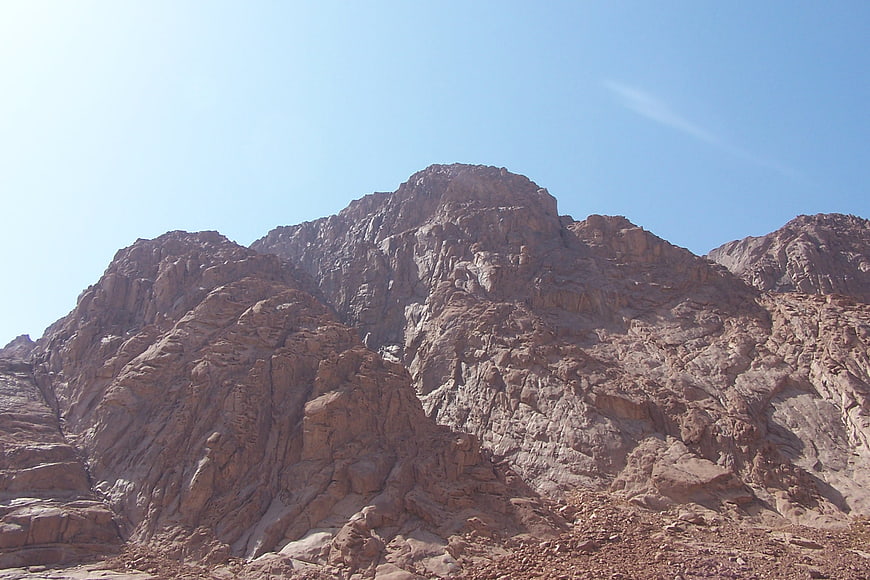 Rugged rocky mountain peak against clear blue sky