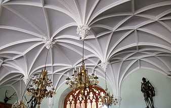 Ornate Gothic Vaulted Ceiling with Chandeliers in Castle Hall