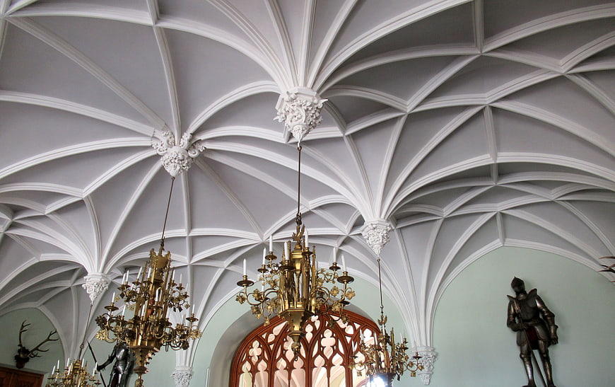 Ornate Gothic Vaulted Ceiling with Chandeliers in Castle Hall