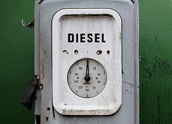 Vintage Diesel Fuel Gauge On Weathered Green Metal Panel