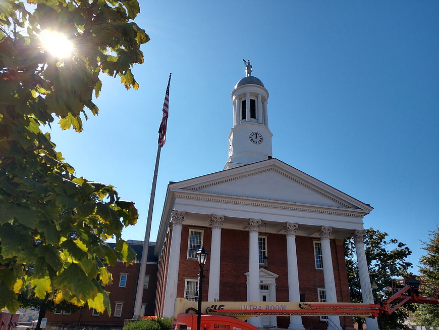 Historic Town Hall with White Columns and Clock Tower
