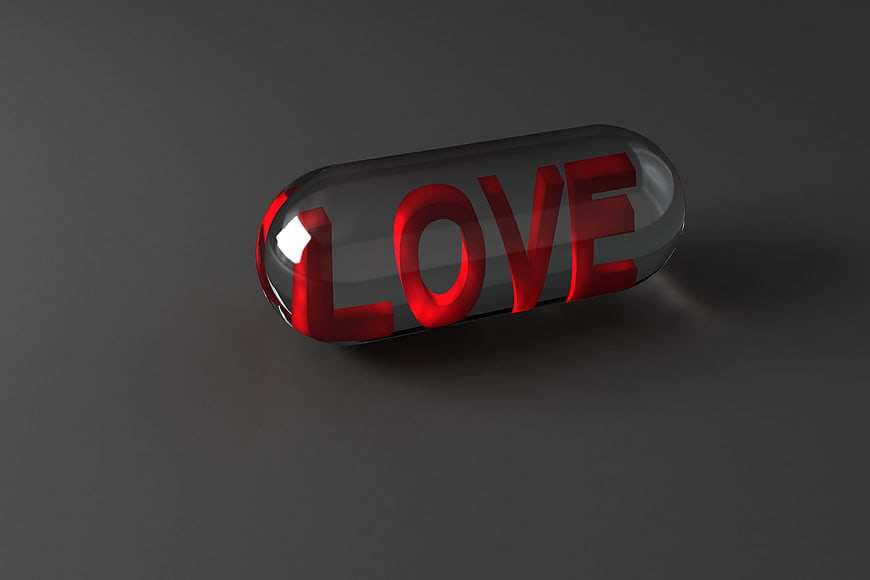 3D Render of Red LOVE Text Inside Transparent Glass Pill Capsule