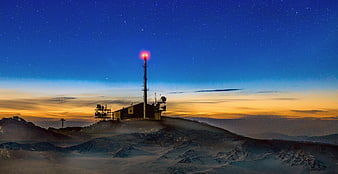 Mountain Relay Station At Dusk With Starry Sky And Sunset