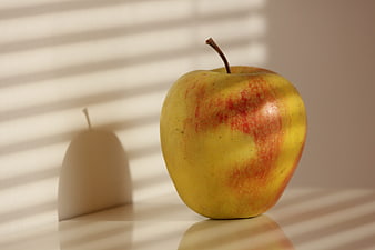 Yellow Apple with Red Blush in Sunlight Shadows