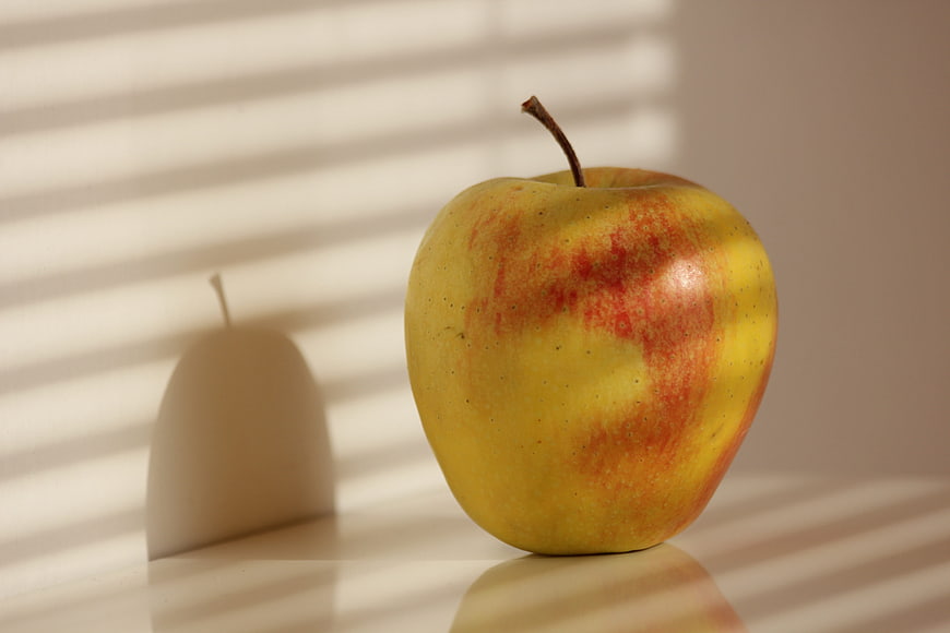 Yellow Apple with Red Blush in Sunlight Shadows