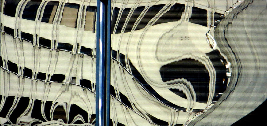 Abstract distorted building reflection on glass facade