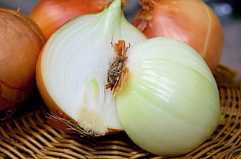 Fresh Yellow Onions in Wicker Basket Close Up