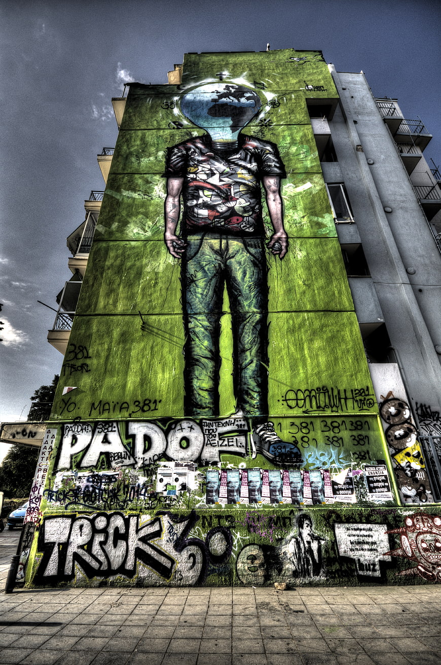 Large Green Alien Mural Graffiti on Urban Building Wall