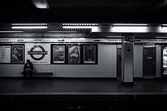 Lonely Woman Sitting Alone on Cannon Street London Underground Platform