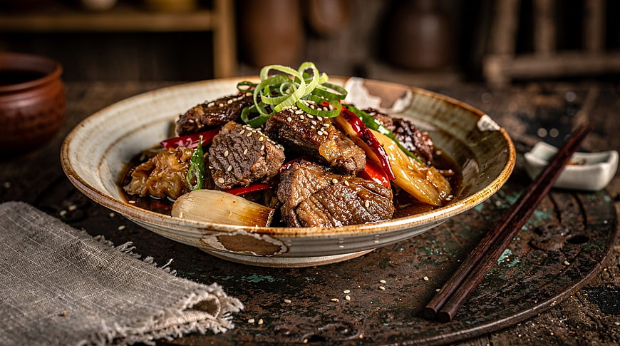 Braised Beef with Vegetables in Rustic Ceramic Bowl