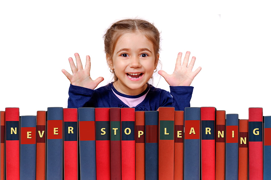 Happy Girl Behind Books Saying Never Stop Learning