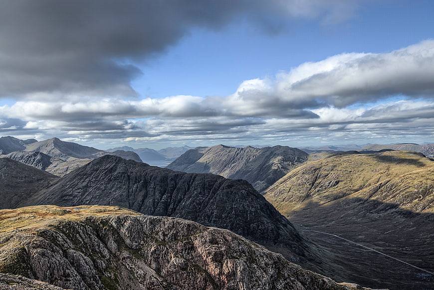 Dramatic Highland Mountain Landscape with Clouds and Valley