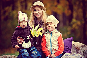 Mother and Two Children in Autumn Park Family Portrait